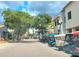 Paver street is lined with golf carts and trees creating a charming and walkable community at 225 Vestrella Dr, Kissimmee, FL 34759