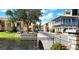 A stone bridge is seen over the waterway with colorful buildings with balconies behind it at 225 Vestrella Dr, Kissimmee, FL 34759