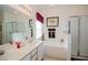 Bright bathroom featuring double sinks, a bathtub, and a glass-enclosed shower at 252 Julliard Blvd, Davenport, FL 33897