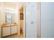 Bathroom featuring a glass-enclosed shower and a vanity with a sink at 252 Julliard Blvd, Davenport, FL 33897