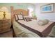 A cozy bedroom featuring a comfortable bed with decorative pillows and matching nightstands at 252 Julliard Blvd, Davenport, FL 33897