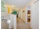 Inviting hallway with neutral tones, carpet, and a peek into a charming bunk room at 252 Julliard Blvd, Davenport, FL 33897