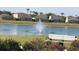 Scenic view of pond with fountain and bench seating, perfect for relaxation and enjoying nature at 252 Julliard Blvd, Davenport, FL 33897