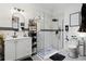 Stylish bathroom featuring white tile, a glass shower, and modern fixtures at 257 New Gate Loop, Lake Mary, FL 32746