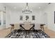 Elegant dining room with a modern chandelier, dining table with seating for eight and a stylish rug at 257 New Gate Loop, Lake Mary, FL 32746