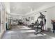 This spacious home gym is well-lit and includes plenty of workout equipment at 257 New Gate Loop, Lake Mary, FL 32746