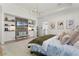 This cozy main bedroom features modern lighting, hardwood floors, and built-in shelving at 257 New Gate Loop, Lake Mary, FL 32746