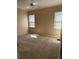 Bedroom featuring carpet floors and natural light from two windows at 2705 Treymore Dr, Orlando, FL 32825