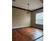 Dining room featuring hardwood floors and a modern chandelier at 2705 Treymore Dr, Orlando, FL 32825