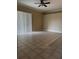 Spacious living room with tile flooring and natural lighting from the large window at 2705 Treymore Dr, Orlando, FL 32825