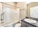 Bathroom featuring a shower-tub combo, toilet, vanity and mirror at 2956 Whispering Trails Dr, Winter Haven, FL 33884