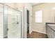 Bathroom featuring shower with clear glass door, toilet and window in the background at 2956 Whispering Trails Dr, Winter Haven, FL 33884