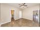 Bedroom featuring polished concrete floors and multiple doorways to the home's other spaces at 2956 Whispering Trails Dr, Winter Haven, FL 33884