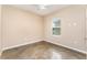 Bedroom featuring polished concrete floors, neutral paint, window and ceiling fan at 2956 Whispering Trails Dr, Winter Haven, FL 33884