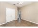 Bedroom with polished concrete floors, neutral paint, a closet, and an open doorway at 2956 Whispering Trails Dr, Winter Haven, FL 33884