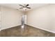 Open bedroom with polished concrete floors, ceiling fan, and neutral paint tone at 2956 Whispering Trails Dr, Winter Haven, FL 33884