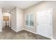 Inviting entryway featuring concrete floors, a window, and a white front door for a bright and modern look at 2956 Whispering Trails Dr, Winter Haven, FL 33884