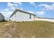 Exterior home view with a large lawn, offering space for recreation and relaxation at 2956 Whispering Trails Dr, Winter Haven, FL 33884