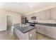 Well-equipped kitchen featuring an island, stainless steel appliances, and sleek countertops at 2956 Whispering Trails Dr, Winter Haven, FL 33884