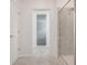 Hallway bathroom features a standup shower with tile and glass door and hallway view at 3036 Country Side Dr, Apopka, FL 32712