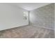 Bedroom featuring a carpeted floor, a large window with blinds and a decorative accent wall at 3036 Country Side Dr, Apopka, FL 32712