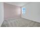 Bedroom with carpet, and a large window providing natural light with neutral colors at 3036 Country Side Dr, Apopka, FL 32712