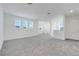 Neutral carpeted bedroom features many windows for optimal natural light at 3036 Country Side Dr, Apopka, FL 32712