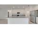 Modern kitchen with sleek countertops, stainless steel appliances, and ample cabinet space at 3036 Country Side Dr, Apopka, FL 32712