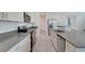 Well-equipped kitchen featuring stainless steel appliances, gray countertops, and white cabinetry at 3036 Country Side Dr, Apopka, FL 32712