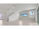 Open-concept living room with tiled floors, recessed lighting, a TV, and backyard views at 3036 Country Side Dr, Apopka, FL 32712