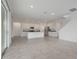 Open concept living room and kitchen with gray tile floors and white cabinetry at 3036 Country Side Dr, Apopka, FL 32712