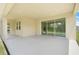 Spacious covered patio with ample room for seating and entertaining, seamlessly connecting to the backyard at 3036 Country Side Dr, Apopka, FL 32712