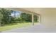 Covered patio offering a serene outdoor living space with views of the landscaped backyard at 3036 Country Side Dr, Apopka, FL 32712