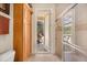 Bright bathroom featuring neutral tile and shower with glass door at 401 Timberwalk Ln, Lake Mary, FL 32746