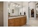 Bathroom vanity with granite counters, a large mirror and access to walk-in closet at 401 Timberwalk Ln, Lake Mary, FL 32746