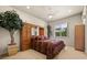 Bedroom with built-in headboard cabinetry and bright window overlooking lush greenery at 401 Timberwalk Ln, Lake Mary, FL 32746