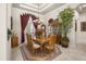 Formal dining room with large window and beautiful chandelier at 401 Timberwalk Ln, Lake Mary, FL 32746