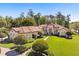 Stunning exterior with lush lawn, manicured landscaping, and a beautiful tile roof at 401 Timberwalk Ln, Lake Mary, FL 32746