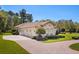 Charming single-story home with a three-car garage and beautifully landscaped front yard at 401 Timberwalk Ln, Lake Mary, FL 32746