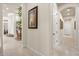 Inviting hallway showcases neutral color palette and stylish tile flooring at 401 Timberwalk Ln, Lake Mary, FL 32746