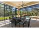 Outdoor patio with ornate dining table and chairs with screened-in pool view at 401 Timberwalk Ln, Lake Mary, FL 32746