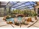 Inviting screened pool featuring a rock waterfall and tranquil setting at 401 Timberwalk Ln, Lake Mary, FL 32746