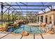 Beautiful screened pool with rock waterfall and lush landscaping at 401 Timberwalk Ln, Lake Mary, FL 32746