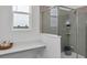 Modern bathroom with a glass-enclosed shower, sleek vanity, and bright natural light at 4120 Jespersen St, Apopka, FL 32712