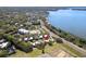 Panoramic aerial view of community nestled amidst lush trees and the tranquil lake waters at 601 W Old Us Highway 441 # 3-A, Mount Dora, FL 32757