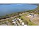 Panoramic aerial view of community nestled amidst lush trees and the tranquil lake waters at 601 W Old Us Highway 441 # 3-A, Mount Dora, FL 32757