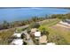 Beautiful aerial view of community featuring a pristine lake in the backdrop on a clear, sunny day at 601 W Old Us Highway 441 # 3-A, Mount Dora, FL 32757