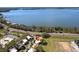 Picturesque aerial view of the home next to the serene lake, highlighting its waterfront living experience at 601 W Old Us Highway 441 # 3-A, Mount Dora, FL 32757