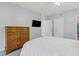 Bedroom with white bed, dresser, and a view of the bathroom and a doorway at 601 W Old Us Highway 441 # 3-A, Mount Dora, FL 32757