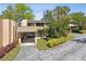 Townhome exterior with manicured landscaping, driveway, and natural lighting at 601 W Old Us Highway 441 # 3-A, Mount Dora, FL 32757